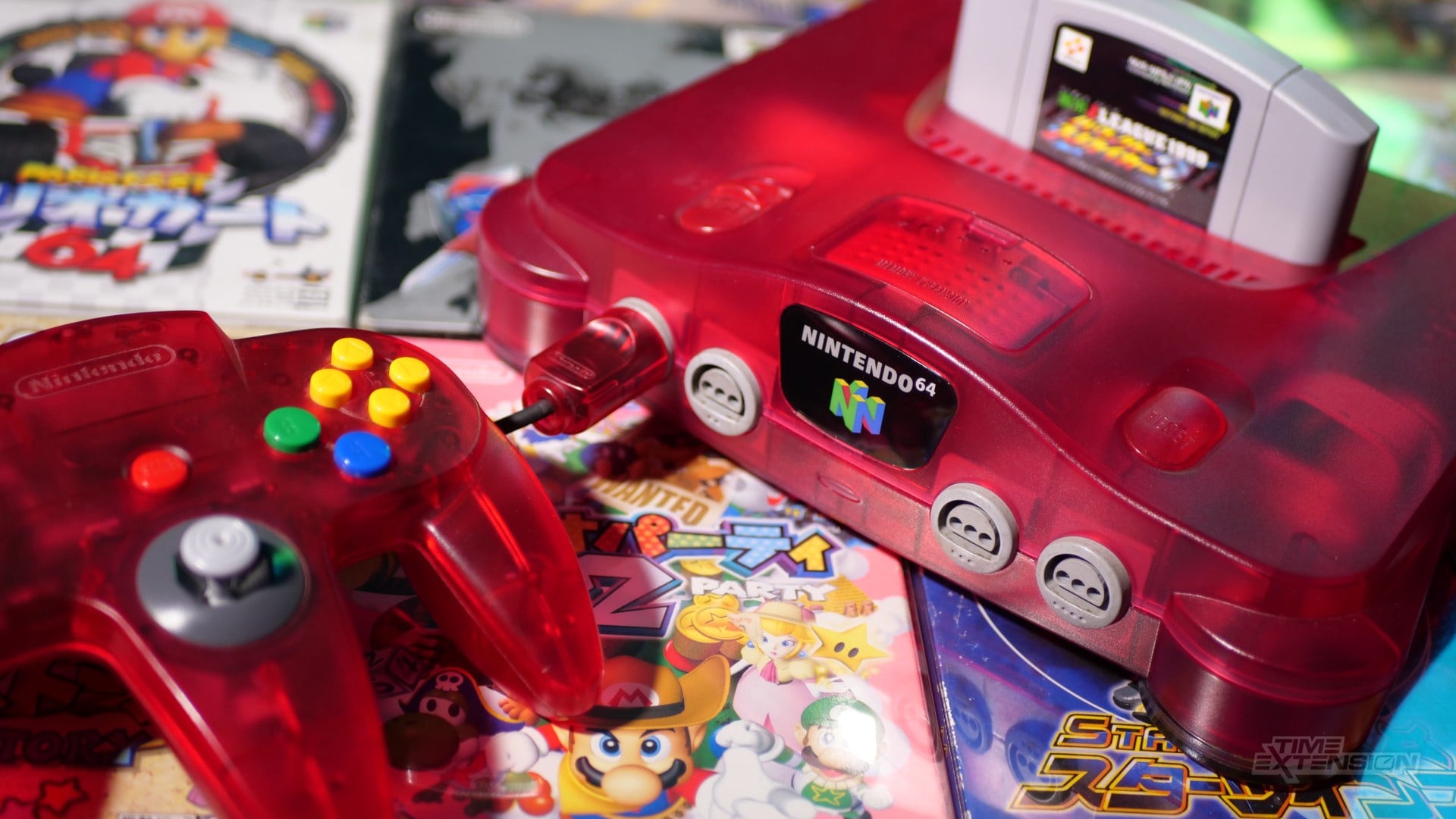 Nintendo 64 controller beside a retro gaming setup