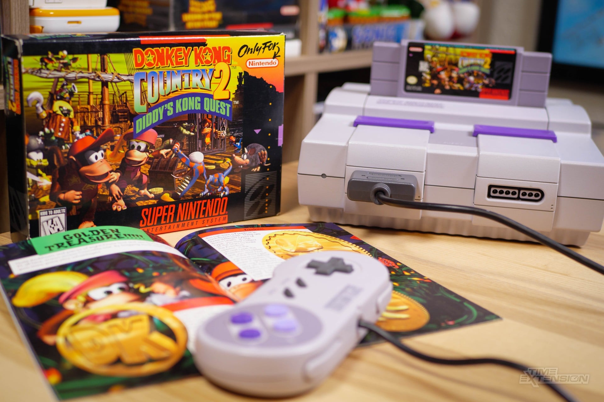 A retro Super Nintendo setup with a snowy emulator-style interface on screen