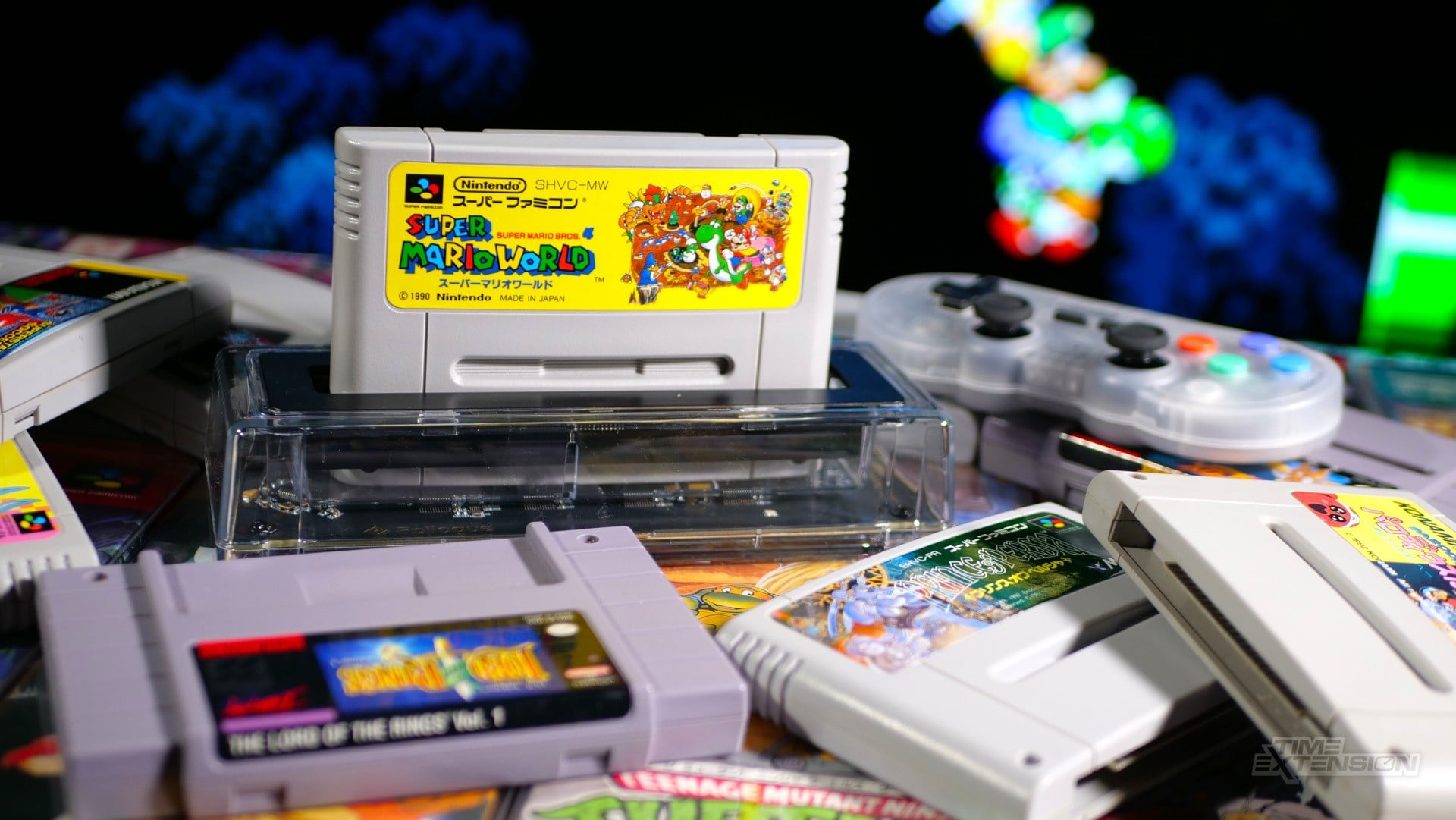 A transparent Epilogue SN Operator cartridge reader connected by USB-C with an SNES cartridge inserted.