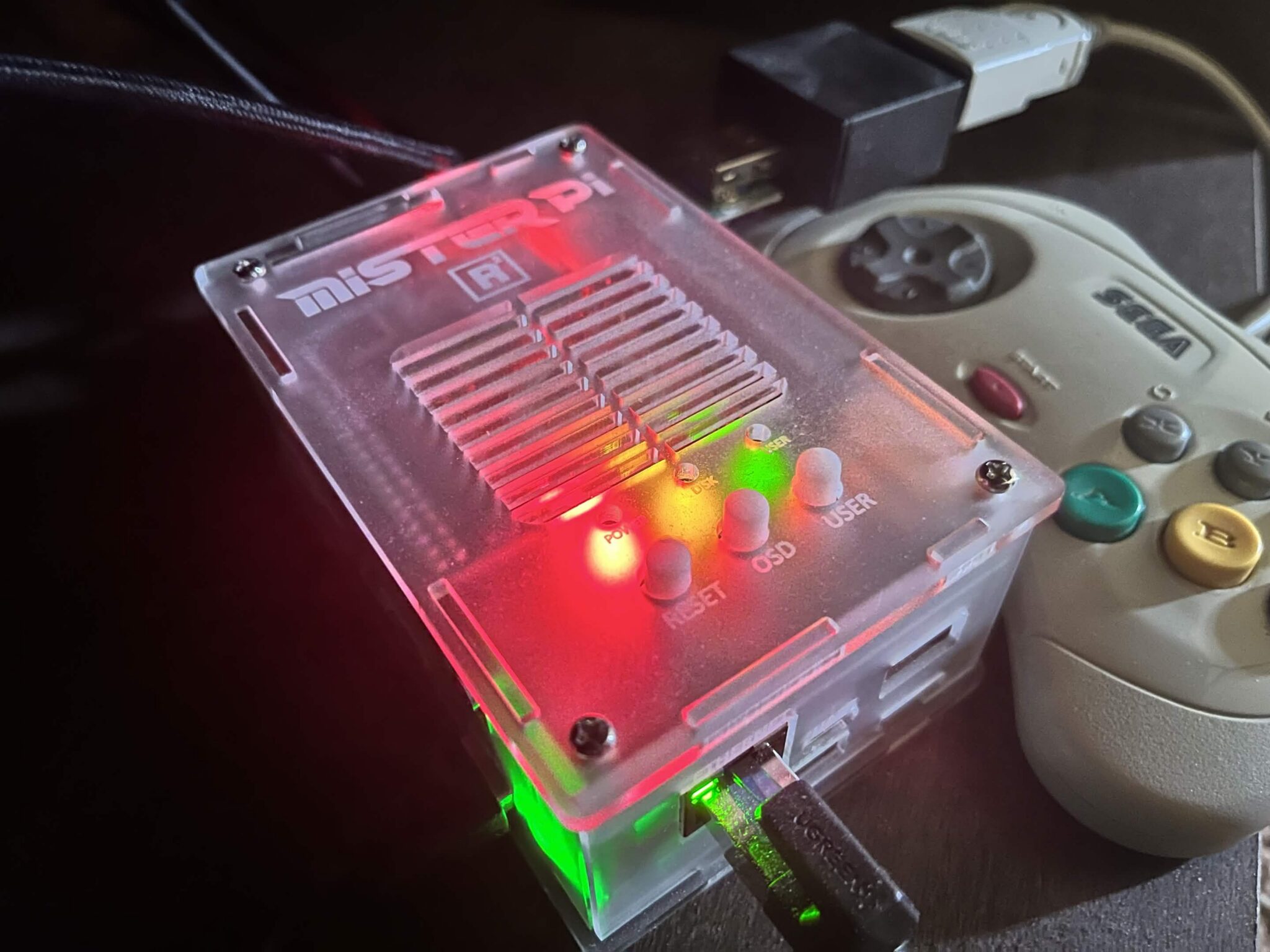 A MiSTer FPGA setup representing Sega Saturn core development and console-style LED activity.