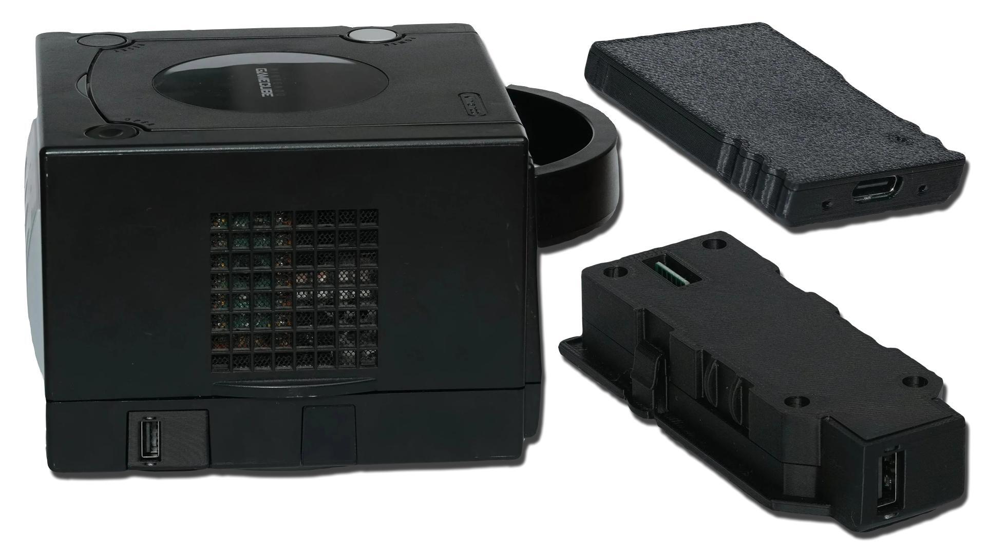 A Nintendo GameCube shown with USB adapter accessories nearby